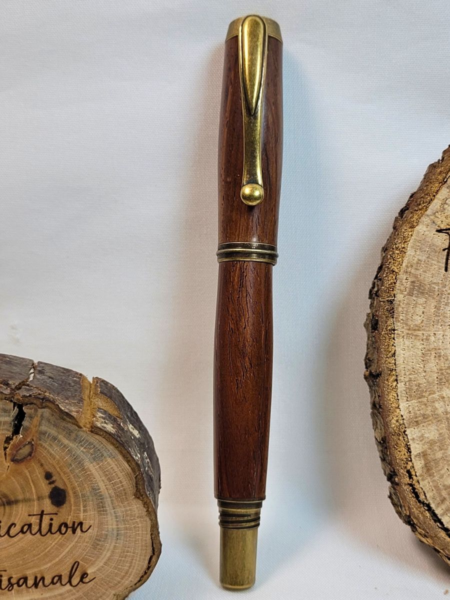 Stylo roller haut de gamme en padouk tourné à la main avec placage bronze